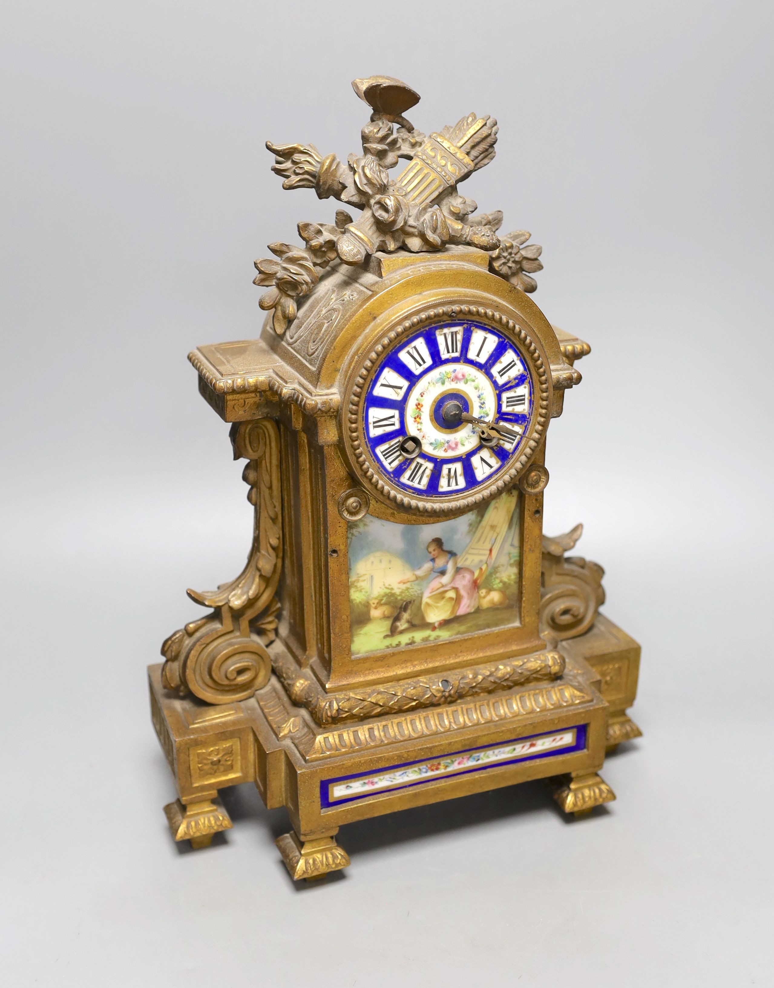 A 19th century French gilt metal and porcelain mantel clock, 36cm high